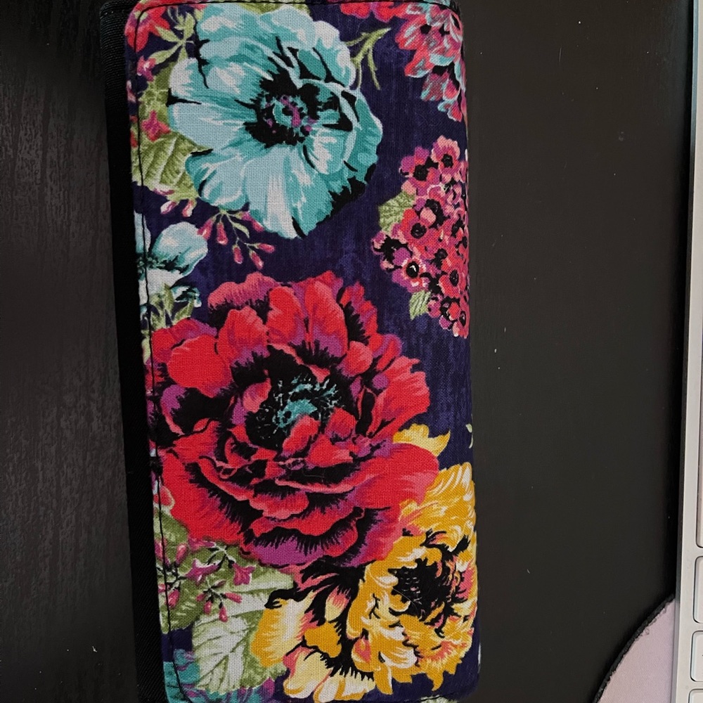 Tri-fold wallet.  Fits a checkbook, ID money and numerous spots for cards.